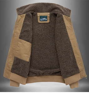 Detail of khaki canvas jacket showing thick dark brown faux sherpa fleece lining and inner pocket