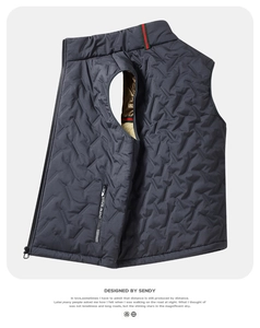 Detailed view of dark grey quilted vest with stand collar and geometric stitching