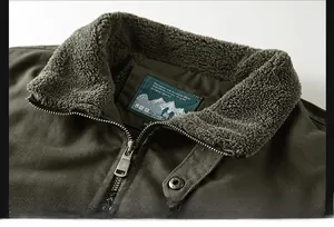 Detail of warm faux shearling lining and durable metal zipper on men's cotton jacket
