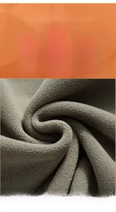 Detail of high-density dark grey fleece fabric with warm and water-resistant texture