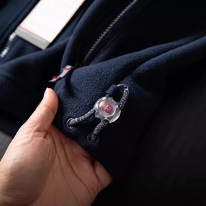 Men's outdoor dark blue polar fleece jacket with functional drawstring and zipper details