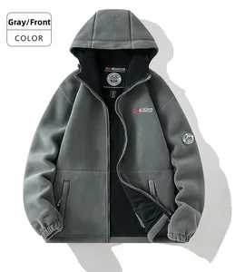 Macro view of grey fleece hoodie jacket showing thick texture and brand patches
