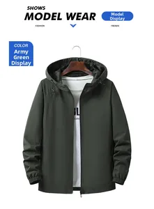 Detail of army green hooded windbreaker jacket with zipper and adjustable drawstring