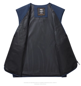 Detail view of the breathable black mesh lining and inner label of the blue outdoor vest