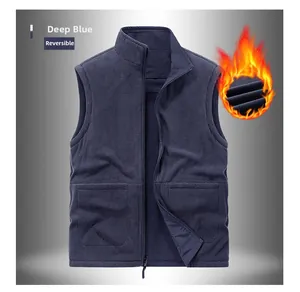 Detail of reversible dark blue fleece vest with large pockets and thermal fabric texture