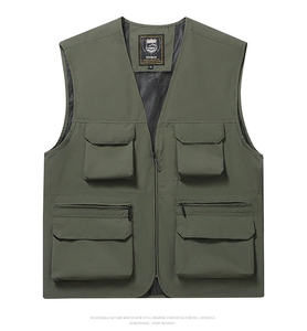 Detail view of military green fishing vest showing multi-pocket design and mesh lining