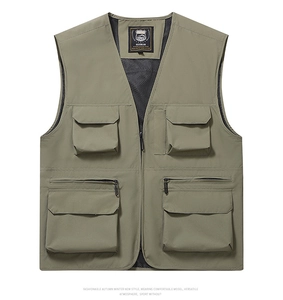Detail view of military green multi-pocket fishing vest with mesh lining and utility zippers