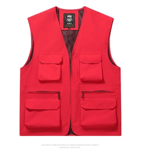 Detail of red outdoor vest featuring four large utility pockets and breathable mesh lining