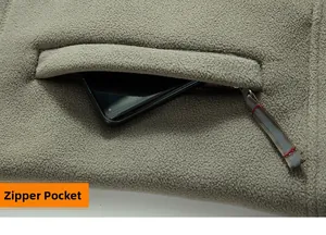 Detail of fleece jacket zippered side pocket with large capacity for a smartphone