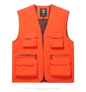 Detail of orange multi-pocket fishing vest with zipper and breathable mesh lining