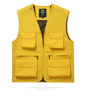 Detail of yellow outdoor fishing vest with multi-pockets and breathable mesh lining