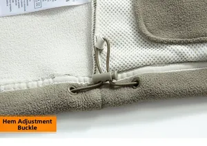 Close-up of adjustable hem with elastic drawstring and toggle on fleece jacket