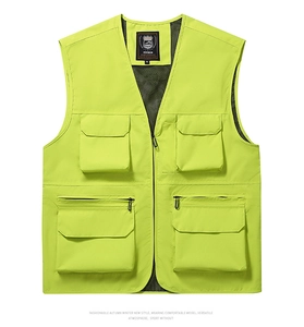 Detail showing fluorescent green utility vest with four large 3D pockets and V-neckline