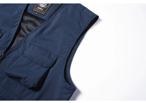Macro view of dark blue tactical vest showing mesh lining and chest pocket detail