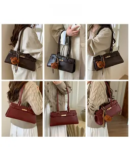 Detail of vintage tote bags in dark brown and burgundy with gold twist locks