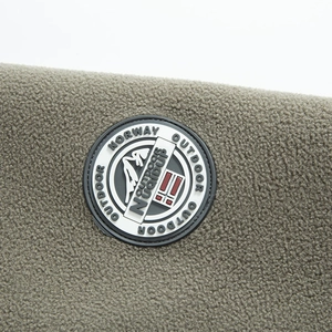 Outdoor fleece hoodie in grey-green with round rubber logo patch and Norway flag detail