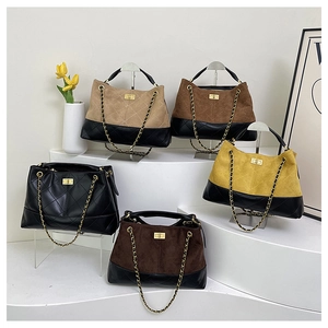 Close-up of diamond quilted crossbody bags in five colors with metal chain and turn-lock
