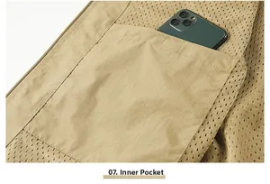 Detail showing the inner pocket storage capacity on a men's khaki outdoor utility vest