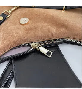 Detail of smooth gold metal zipper and suede lining on a modern contrast backpack