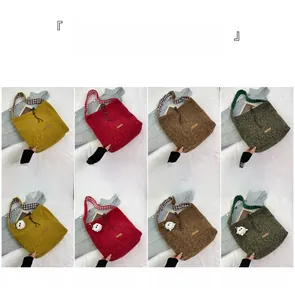 Detail view of wool tote bags in four colors with optional cute sheep pendant accessories