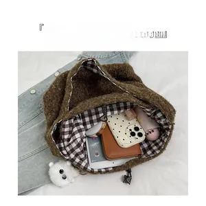 Brown fuzzy tote bag with checkered lining showing spacious interior for essentials