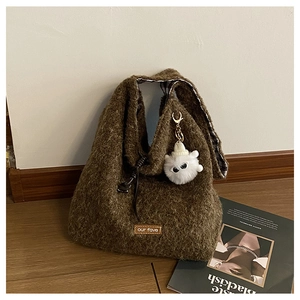 Detail showing plush brown tote bag interior with black and white checkered fabric lining