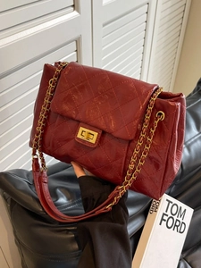 Red quilted oil wax leather chain bag with gold metal hardware and turn-lock closure