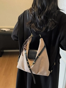 Minimalist khaki suede tote bag with black leather straps and gold buckle for women