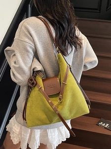 Retro mustard green suede hobo tote bag with brown leather trim and knot charm detail