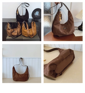 Detail of suede hobo bags in black and brown with vintage wooden bead charms