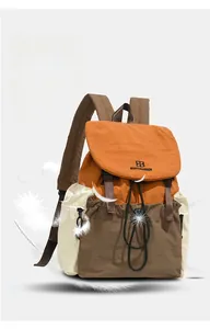 Detail view of the lightweight three-color outdoor backpack showing the buckle and logo