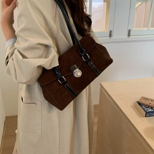 Deep brown suede shoulder bag featuring a silver metal buckle and vintage buckle clasp