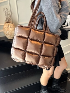 Glossy dark brown quilted puffer tote bag for women featuring stylish oversized padded design