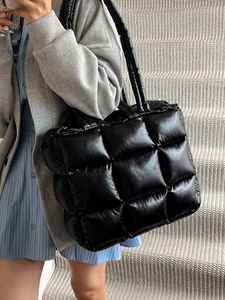 Stylish black quilted puffer tote bag with glossy finish and square padded design