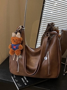 Deep brown Hobo shoulder bag in soft leather texture with cute teddy bear charm