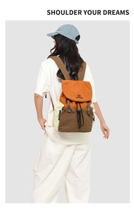 Detail view of the tricolor outdoor backpack showing buckle closure and ergonomic fit