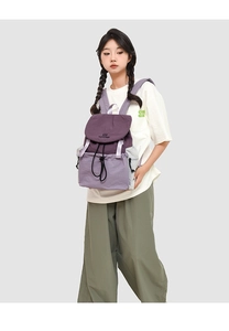 Detailed view of color-block backpack with drawstring closure and purple nylon texture