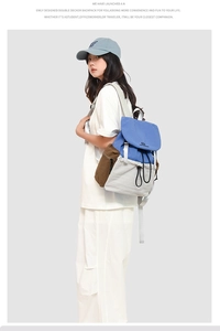 Model showing double-decker backpack in blue, grey, and brown patchwork design