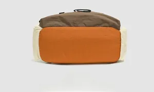 Detailed bottom view of water-resistant nylon backpack with reinforced stitching