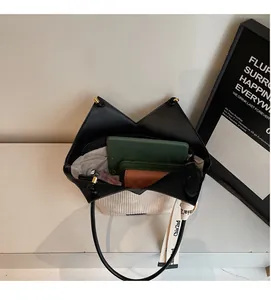 Interior view showing large capacity of cream corduroy tote bag with black leather trim