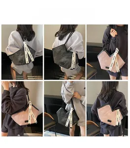 Detailed views of multi-color tote bag with ribbon straps and V-shaped design