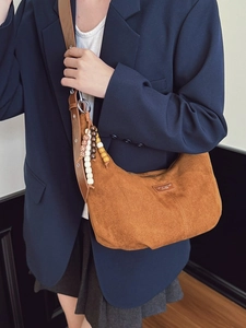 Brown faux suede hobo bag with colorful bead tassels and wide shoulder strap