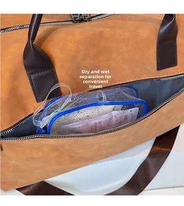Detail view of the dry-wet separation pocket with waterproof lining on the brown travel bag
