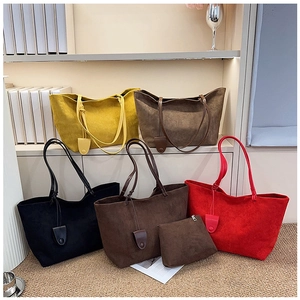 Close-up of matte vintage tote bag set in various colors with a matching small pouch