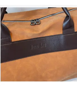 Close-up of vintage yellow PU leather travel bag with Noco BAG embossed logo detail