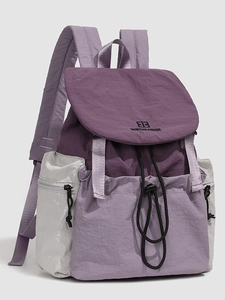 Deep purple and light lavender color-block travel backpack with drawstring and flap closure