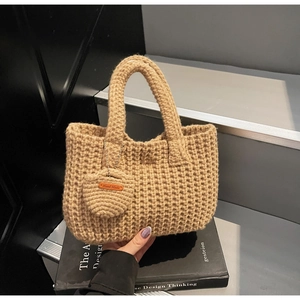 Detail of hand-woven tote bag with handmade leather tag on a stylish round charm