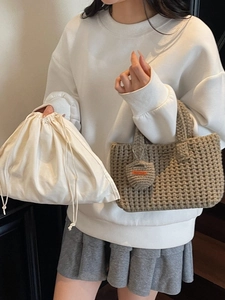 Handmade grey knit bucket bag set with Hand Made charm and white cotton drawstring dust bag
