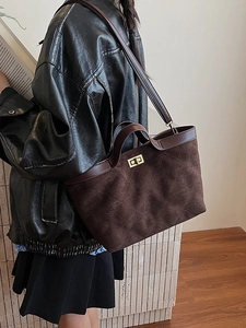 Retro brown suede tote bag with diamond lattice pattern and metallic gold twist lock