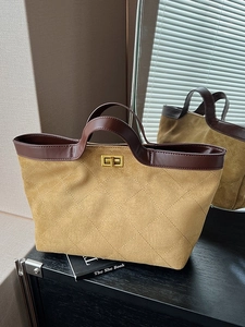 Retro khaki suede tote bag with quilted diamond pattern and golden twist lock detail